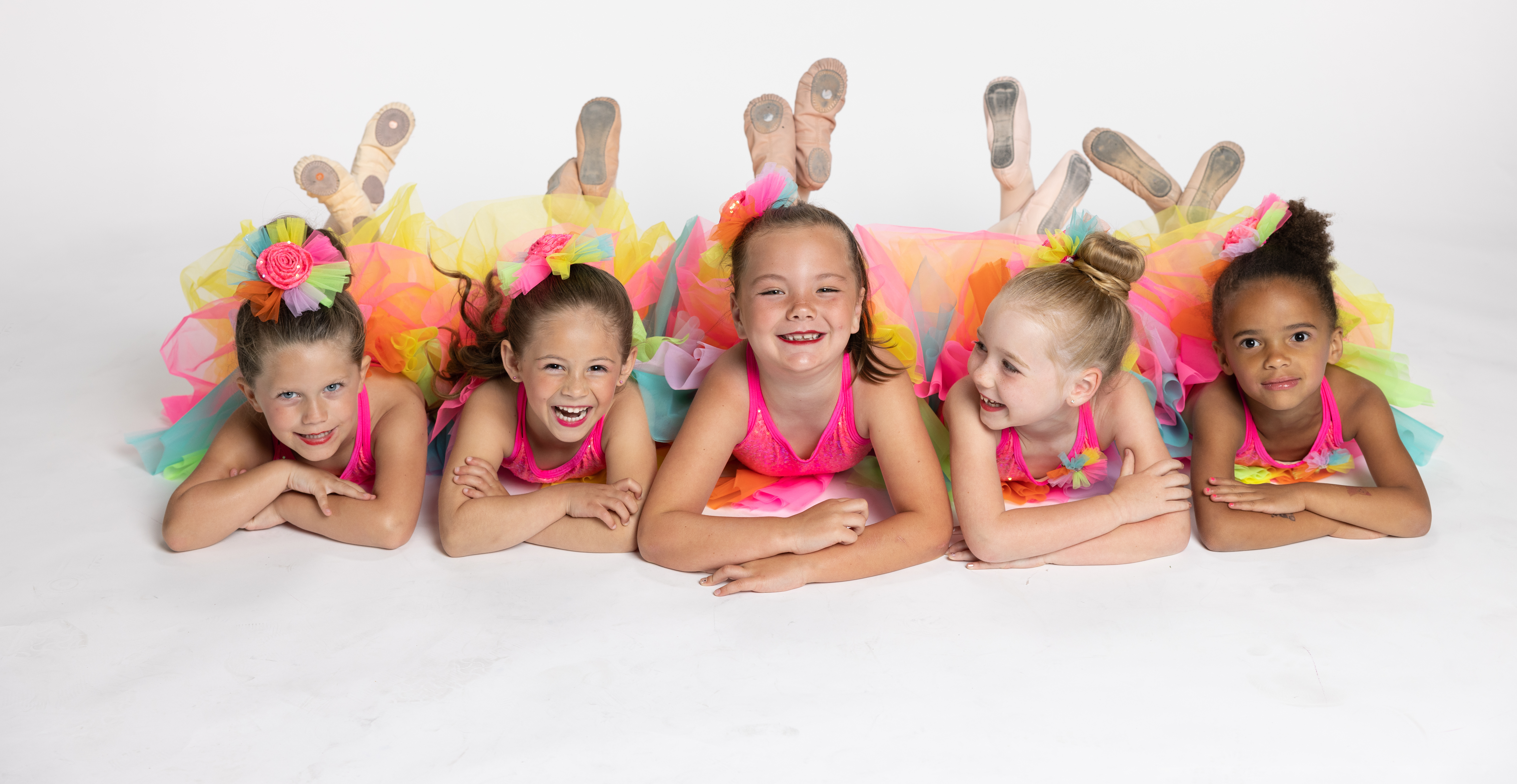 little dancers in costume in a row
